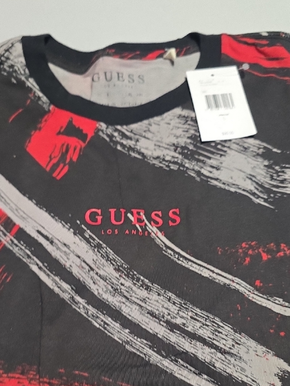 GUESS Black Tee with Red and Gray Brushstroke Logo